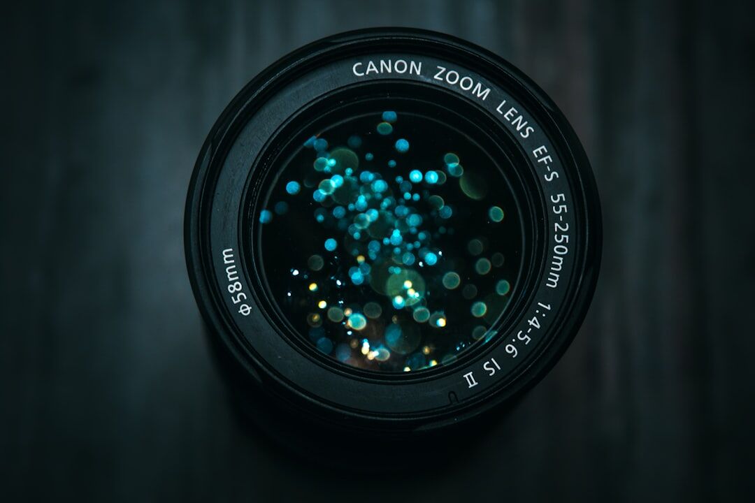 Close up of a camera lens capturing a photo at night